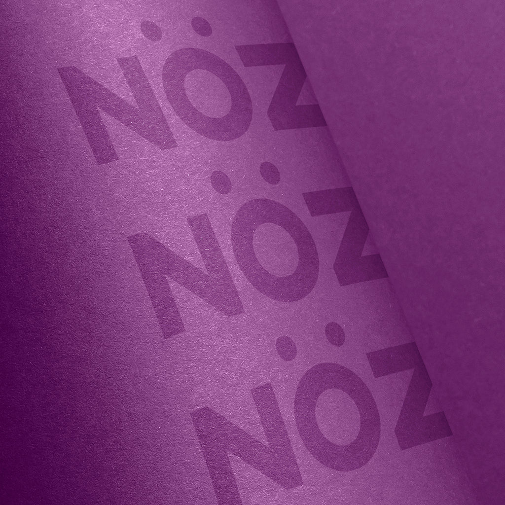 Close up of Noz reef safe and eco sunscreen. Tube of Nozscreen purple.