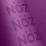 Load image into Gallery viewer, Close up of Noz reef safe and eco sunscreen. Tube of Nozscreen purple.
