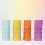 Load image into Gallery viewer, Noz reef safe, colorful, and eco sunscreen tubes in a variety of colors. Blue, yellow, orange, and purple Nozscreen
